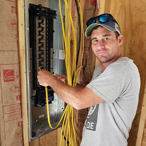 Night School Electrician Wiring a Circuit Box